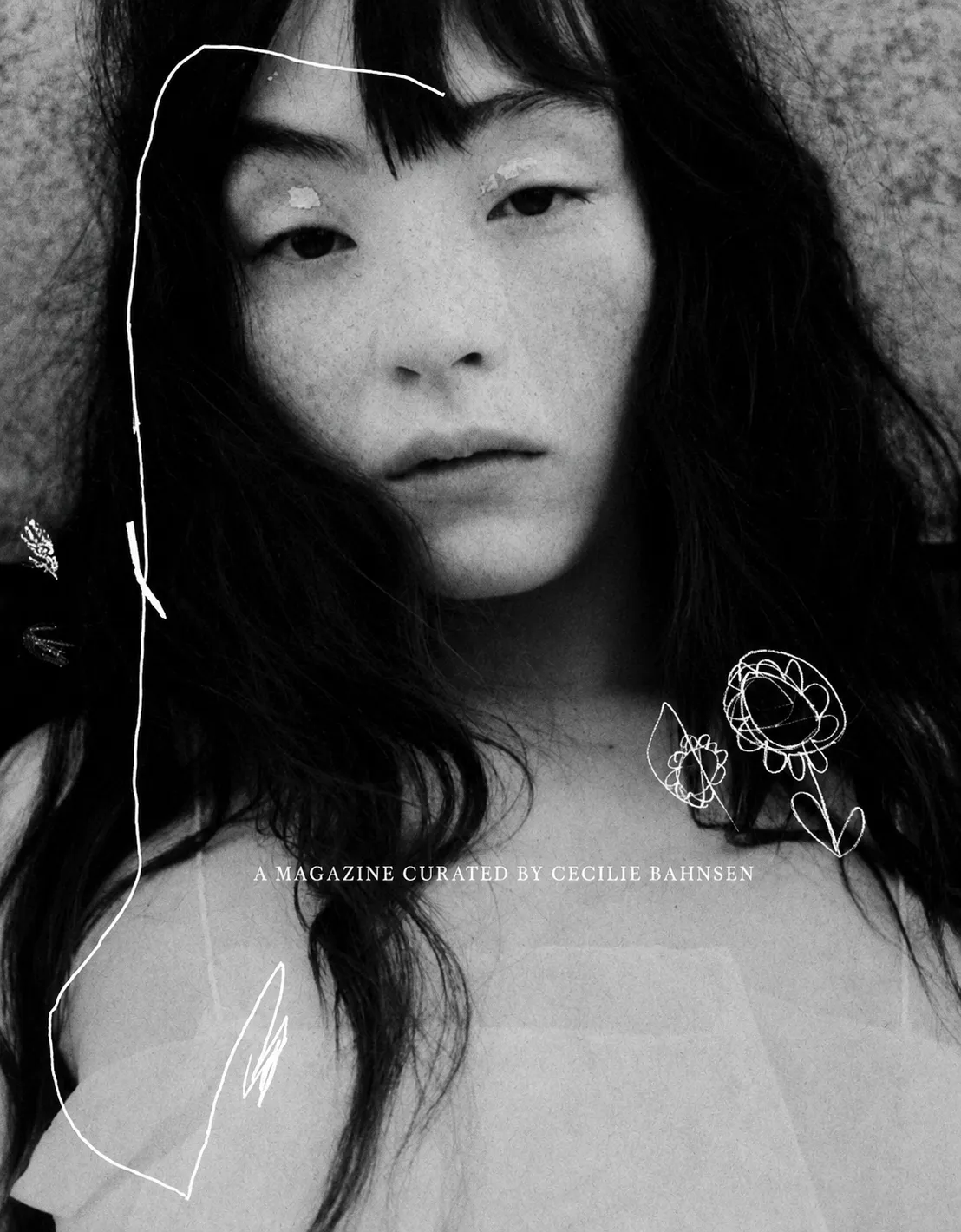 Black-and-white cover of A Magazine Curated By Cecilie Bahnsen showing a close portrait overlaid with white line drawings of flowers